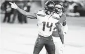  ?? CHRIS SZAGOLA AP ?? The Seahawks’ DK Metcalf reacts after a first-down catch during the first half against the Eagles.