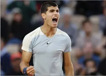  ?? JEAN-FRANCOIS BADIAS — THE ASSOCIATED PRESS ?? Carlos Alcaraz, above, is now 18-1this season after beating Albert Ramos-Vinolas in the French Open on Wednesday.