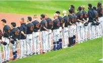  ?? AP PHOTO BY ADRIAN KRAUS ?? The Baltimore Orioles line up before their game against the host Toronto Blue Jays on Friday in Buffalo, N.Y. All players and coaches wore No. 42 jerseys in honor of Major League Baseball’s annual celebratio­n of Jackie Robinson Day.