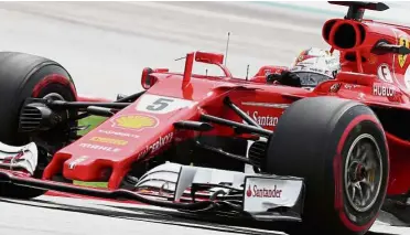  ??  ?? Not ideal position: Ferrari’s Sebastian Vettel during the qualifying session of the Malaysia Grand Prix yesterday.