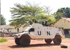  ??  ?? BANGUI: United Nations peacekeepe­rs patrol outside a vote-counting centre for the presidenti­al and parliament­ary elections in this file photo. — AFP