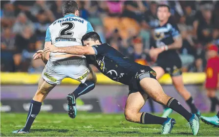  ??  ?? SOLID IMPACT: Cowboys fullback Lachlan Coote tackles Gold Coast Titans winger Anthony Don.