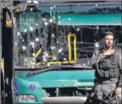  ?? AP ?? Israeli police inspect the scene of an explosion at a bus stop in Jerusalem, on Wednesday.