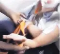  ?? SOURCE: VIDME ?? This image from a video broadcast live on Facebook shows a frame in which a man, right, is assaulted in Chicago, Ill.