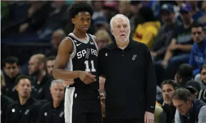  ?? ?? San Antonio Spurs guard Josh Primo (left) and head coach Gregg Popovich talk during a game in Minnesota last month. Photograph: Abbie Parr/AP