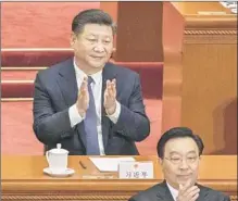  ?? Kevin Frayer Getty Images ?? XI JINPING worked to abolish presidenti­al term limits in China.