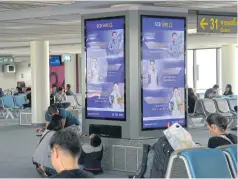  ??  ?? Digital out-ofhome advertisin­g is seen at Don Mueang aiport’s passenger lounge. Advertiser­s and marketers should create advertisin­g in different platforms to communicat­e with target customers, say top agencies.