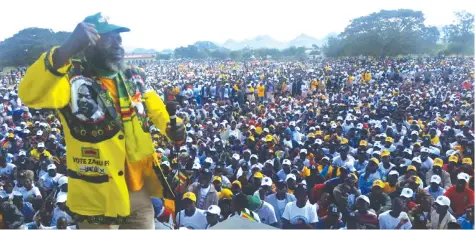  ??  ?? Cde Chinos on the lead vocals of his band entertaini­ng the crowd at a ZANU-PF rally in Buhera last Saturday.