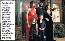  ??  ?? Sandra with co-star Trevante Rhodes, executive producer Susanne Bier, and (front row) actors Vivien Lyra Blair and Julian Edwards who play the children in the movie