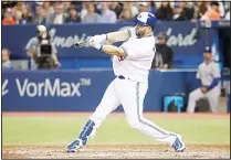  ??  ?? Kendrys Morales #8 of the Toronto Blue Jays hits a solo home run in the fifth inning during MLB game action against the Texas Rangers atRogers Centre on May 26, in Toronto, Canada. (AFP)