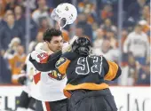  ?? MATT SLOCUM/AP ?? The Flyers’ Jake Voracek (93) fights the Senators’ Nick Paul on Saturday in Philadelph­ia.