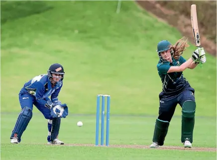  ?? PHOTO: ANDY JACKSON/FAIRFAX NZ ?? Hinds batter Anlo van Deventer, right, cracks a shot through the off side in their game against Otago in New Plymouth on Saturday.