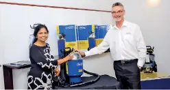  ??  ?? Pacvac Sales Head Graeme Trebley with first local owner of a Pacvac Backpack Vacuum Cleaner Pix by Waruna Wanniarach­chi