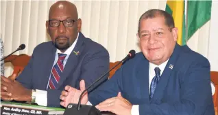  ??  ?? Finance and the Public Service Minister Audley Shaw (right) addresses a press conference at his ministry at the National Heroes Circle in Kingston on Friday. At left is state minister in the ministry, Rudyard Spencer.