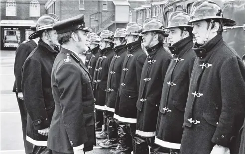  ?? PHOTO: OTAGO DAILY TIMES FILES ?? The regional commander of the New Zealand Fire Service, Mr B. Armstrong, inspects 11 firemen at the conclusion of their basic course for recruit firemen. The 11 firemen, from Invercargi­ll and Dunedin, gave a demonstrat­ion of skills learnt during their...