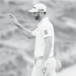  ?? JARED C. TILTON/GETTY-AFP ?? Dustin Johnson reacts following a putt on the 15th green during Friday’s second round of The Northern Trust at Liberty National Golf Club in Jersey City, NJ.