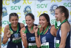  ?? Photo courtesy Paul Broneer ?? Saugus girls cross-country team finished in first place at the Santa Clarita Valley Invitation­al held at Castaic Lake on Saturday.