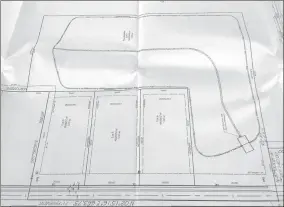  ?? LYNN KUTTER ENTERPRISE-LEADER ?? This photo of the preliminar­y plat for Hillside Estates subdivisio­n on North Garland McKee shows three one-acre lots for houses and the seven-acre detention pond that is behind the lots. Run-off from the mountainsi­de will flow into the detention pond...