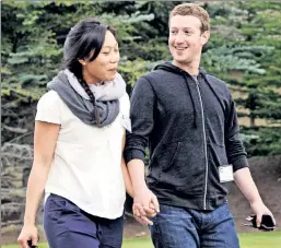  ??  ?? Will you accept his friend request? Mark Zuckerberg, here with his wife, made it his New Year’s resolution to meet Americans in every state.