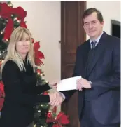  ??  ?? Jane Mizzi from Foodbank Lifeline Foundation (left) receiving donation on behalf of employees from Felipe Navarro (right), President and CEO of MAPFRE Middlesea