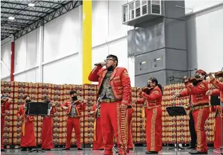  ?? Christian Alejandro Ocampo / Staff photograph­er ?? The Martin High School mariachi band performs Wednesday during the grand opening of Mission Produce’s massive distributi­on center in Laredo.