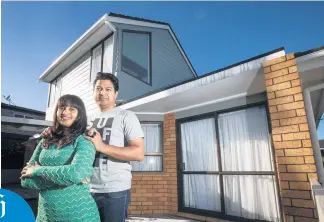  ?? Picture / Jason Oxenham ?? Bharat Bhushan and Lovely Garg, outside their previous rental property, cut their budget to buy a $ 550,000 townhouse in Glen Eden. Bharat says he learned “you need to do some compromise­s”.