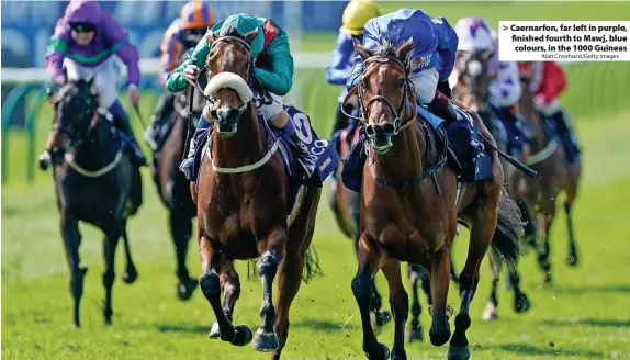  ?? Alan Crowhurst/Getty Images ?? > Caernarfon, far left in purple, finished fourth to Mawj, blue colours, in the 1000 Guineas