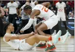  ?? NAM Y. HUH — THE ASSOCIATED PRESS ?? Miami’s Isaiah Wong, a Bonner-Prendergas­t All-Delco, is congratula­ted by Kameron McGusty, top, after making a shot and being fouled against Iowa State in the Sweet 16 on Friday in Chicago.