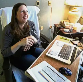  ??  ?? Good news: Williams watching the news on the healthcare vote while receiving treatment at Lawrence Memorial Hospital in Lawrence, Kansas. — AP