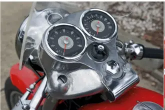  ??  ?? ABOVE Smiths instrument­s nestle in the classy shroud over the top fork crown. ABOVE CENTRE Clip-on bars and racing screen are café racer prerequisi­tes. ABOVE RIGHT Midriff cover hides battery, coil and rectifier. RIGHT Rubber moulding joins the...