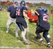  ?? MERCURY FILE PHOTO ?? Pottstown head coach Brett Myers gets a jug of water dumped on him after the Trojans won their Thanksgivi­ng Day matchup with OJR in 2007.