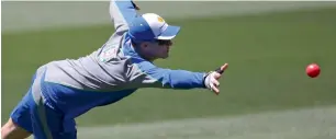  ?? AP ?? Australia’s Peter Handscomb reaches for the ball during a training session in Adelaide on Wednesday. —