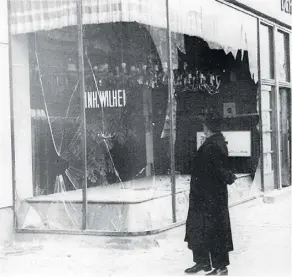  ?? THE ASSOCIATED PRESS ?? A man looks at the wreckage of a Jewish shop in Berlin on Nov. 10, 1938, in the aftermath of the Night of Broken Glass, a nationwide attack by Nazi forces often considered the start of the Holocaust.