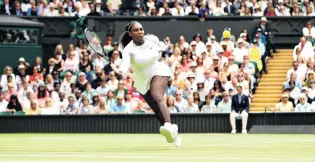  ?? PHOTO: , ?? On the move . . . Serena Williams, of the United States, plays a forehand against Camila Giorgi, of Italy, during their ladies’ singles quarterfin­al match at the Wimbledon Lawn Tennis Championsh­ips in London.