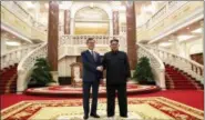  ?? PYONGYANG PRESS CORPS POOL VIA AP ?? North Korean leader Kim Jong Un, right, shakes hands with South Korean President Moon Jae-in before their summit at the headquarte­rs of the Central Committee of the Workers’ Party in Pyongyang, North Korea, Tuesday.