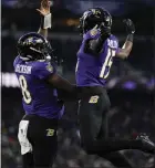  ?? NICK WASS — THE ASSOCIATED PRESS ?? Baltimore’s Nelson Agholor, right, celebrates his touchdown catch with quarterbac­k Lamar Jackson on Saturday in Baltimore.