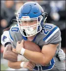  ?? JOHN SMIERCIAK/POST-TRIBUNE ?? Lake Central’s Ricky Guerrero carries the ball against Michigan City on Saturday.