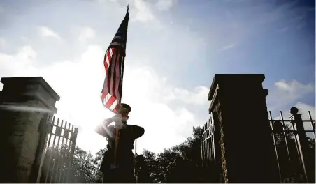  ?? Elizabeth Conley / Staff photograph­er ?? Specialist Caleb York participat­es in a wreath-laying birthday ceremony in College Station at the gravesites of former President George H.W. Bush and first lady Barbara Bush. Their birthdays were on June 12 and June 8, respective­ly.