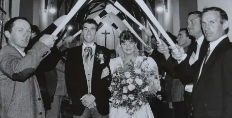  ??  ?? Members of St Brendan’s Hurling Club provide a guard of honour for Mary Enright of Tarbert and Tommy O’Connor of Ardfert on their wedding day.