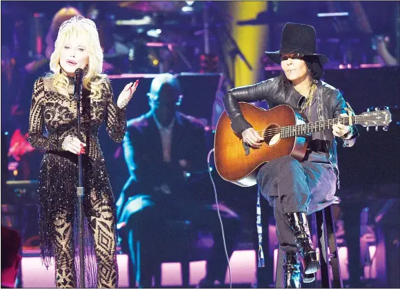  ?? (AP) ?? Honoree Dolly Parton and Linda Perry perform ‘Coat of Many Colors’ at MusiCares Person of the Year on Feb 8, 2019, at the Los Angeles Convention Center.