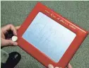  ?? AFP/GETTY IMAGES ?? An Etch-A-Sketch in action
