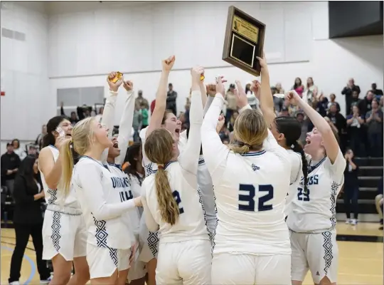  ?? BEN MOTA — CONTRIBUTE­D PHOTOS ?? The Pleasant Valley girls basketball team celebrates its second straight Northern Section Division III championsh­ip on Friday at Butte College. The Vikings defeated Chico 60-43.