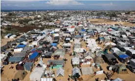  ?? Photograph: Ibraheem Abu Mustafa/Reuters ?? Displaced Palestinia­ns take shelter in a camp in Rafah, which itself is under threat of a ground invasion by Israel.