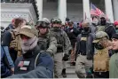  ?? Photograph: Jim Bourg/ Reuters ?? Members of the Oath Keepers march down the east front steps of the US Capitol on 6 January 2021.