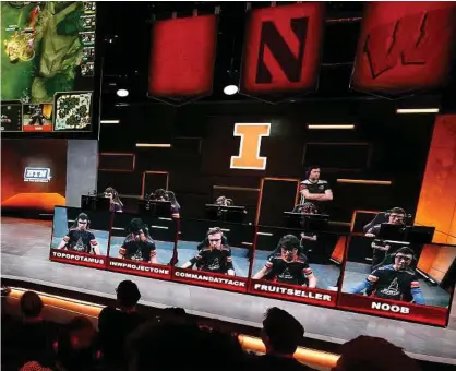  ?? Mel Melcon/Los Angeles Times ?? The audience watches a match between the University of Maryland, left, and the University of Illinois in the Big Ten Network “League of Legends” championsh­ip in the Battle Theater at North American League Championsh­ip Arena at Riot Games on March 28....