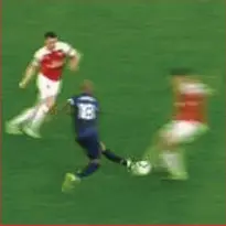  ??  ?? Studs up: Young is lucky after foul on Koscielny