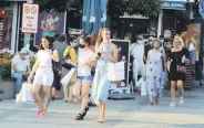  ??  ?? Tourists are seen in the southern province of Antalya, Turkey, Sept. 24, 2020.