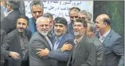  ?? AP ?? Iran’s foreign minister and nuclear negotiator Mohammad Javad Zarif (2nd from L) joins celebratio­ns in parliament in Tehran on Sunday.