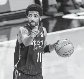  ?? Sarah Stier / Tribune News Service ?? Kyrie Irving is thought to be unvaccinat­ed although he sidesteppe­d questions on that topic this week.
