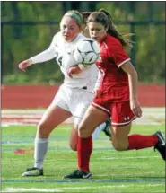  ?? STAN HUDY - SHUDY@DIGITALFIR­STMEDIA.COM ?? Shenendeho­wa sophomore midfielder Danielle Casey looks to get around a Baldwinsvi­lle defender in the first half of Saturday’s NYSPHSAA Class AA Regional at Stillwater H.S.